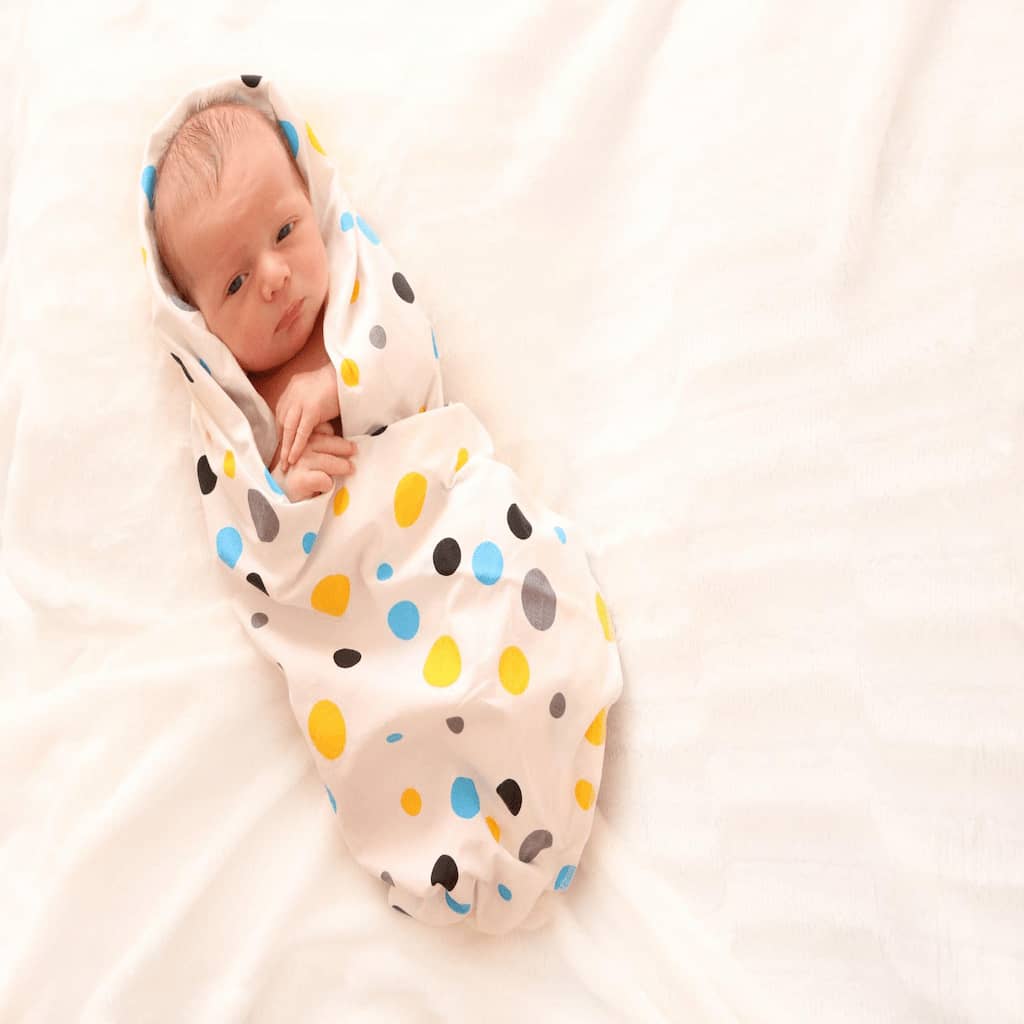 when to unswaddle baby